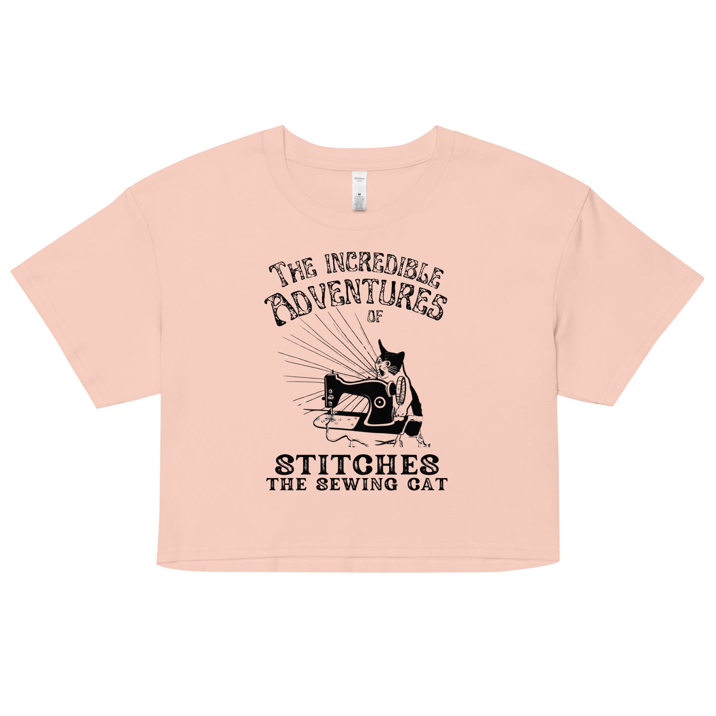 Pale Pink Crop top with "The Incredible Adventures of Stitches the Sewing Cat – The Perfect Gift for People who Love to Sew